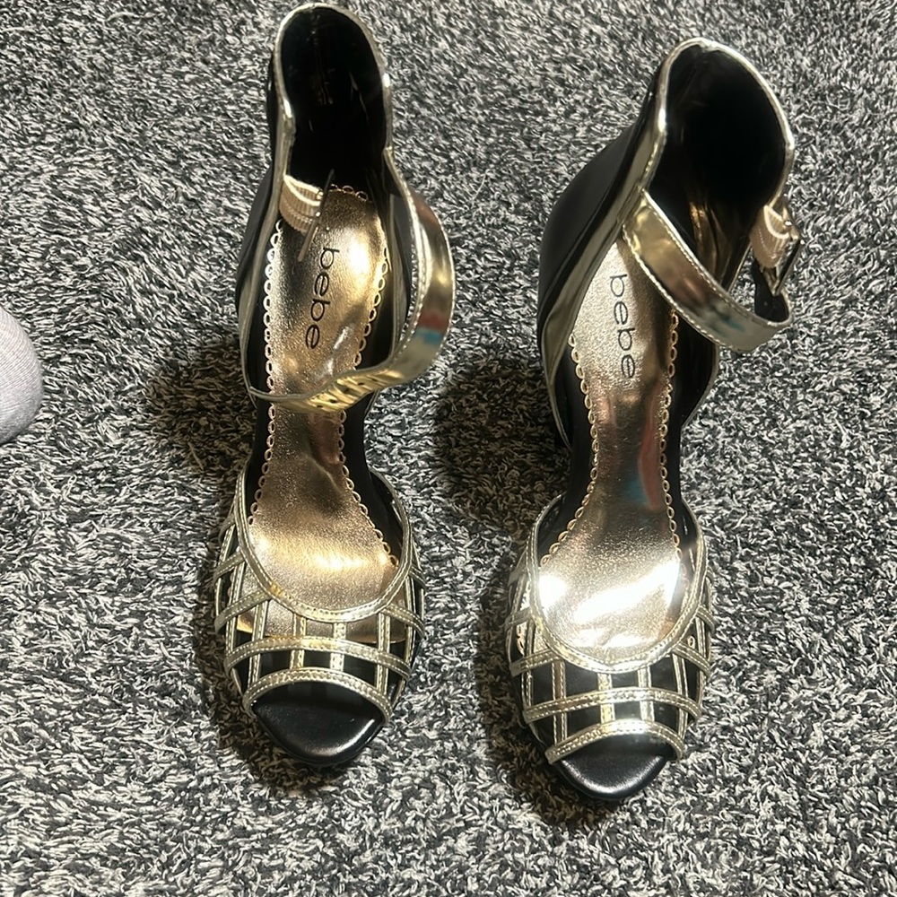 BeBe woman’s black and gold heel worn a couple times size 7